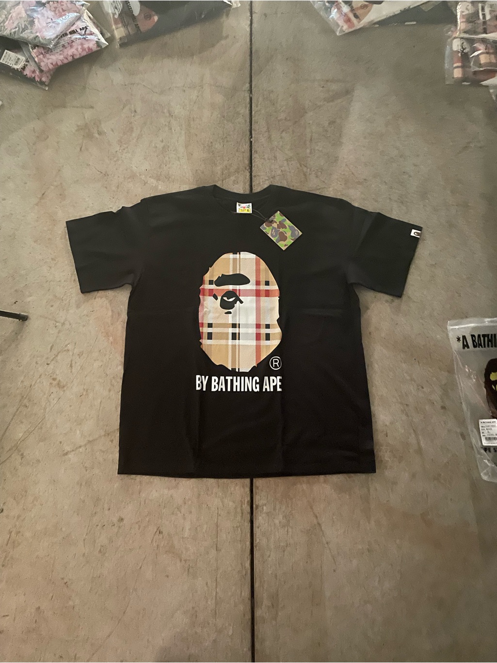 Bape Black Tee With Green Blue And Brown Camo Tag